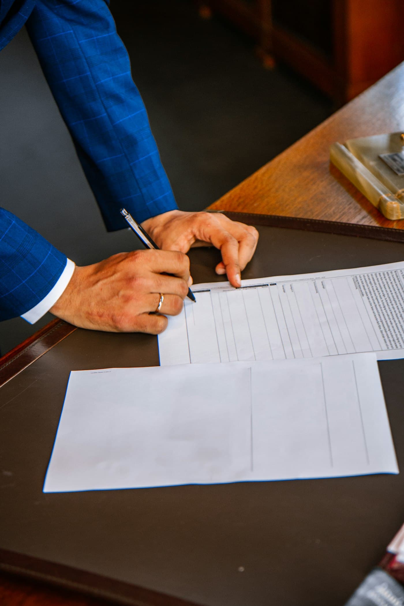 A client signing a retainer agreement